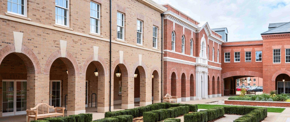 An arcade runs around three sides of the main court