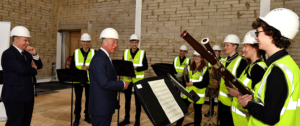 HM King Charles III when he was the Prince of Wales listened to RCM students during his 2019 visit