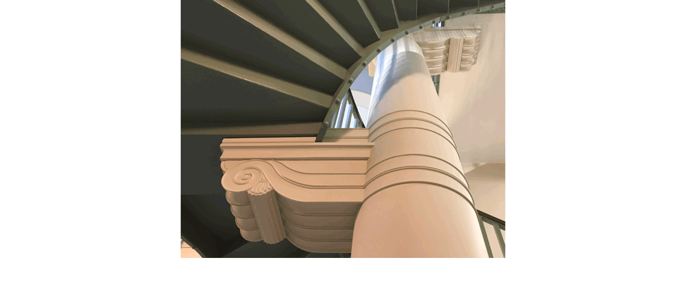 Principal staircase linking the soaring triple-height foyer
